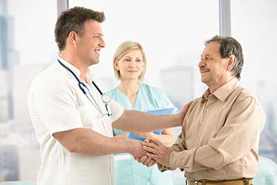 doctor and man shaking hands